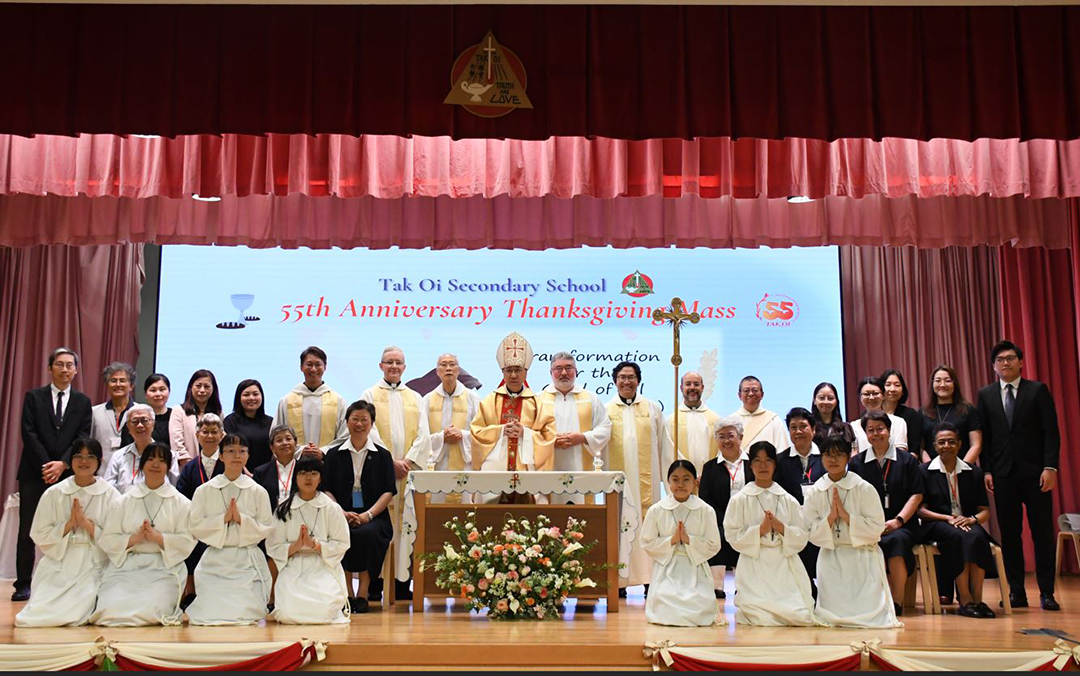 A group of girls wearing masks and standing in front of a statueDescription automatically generated